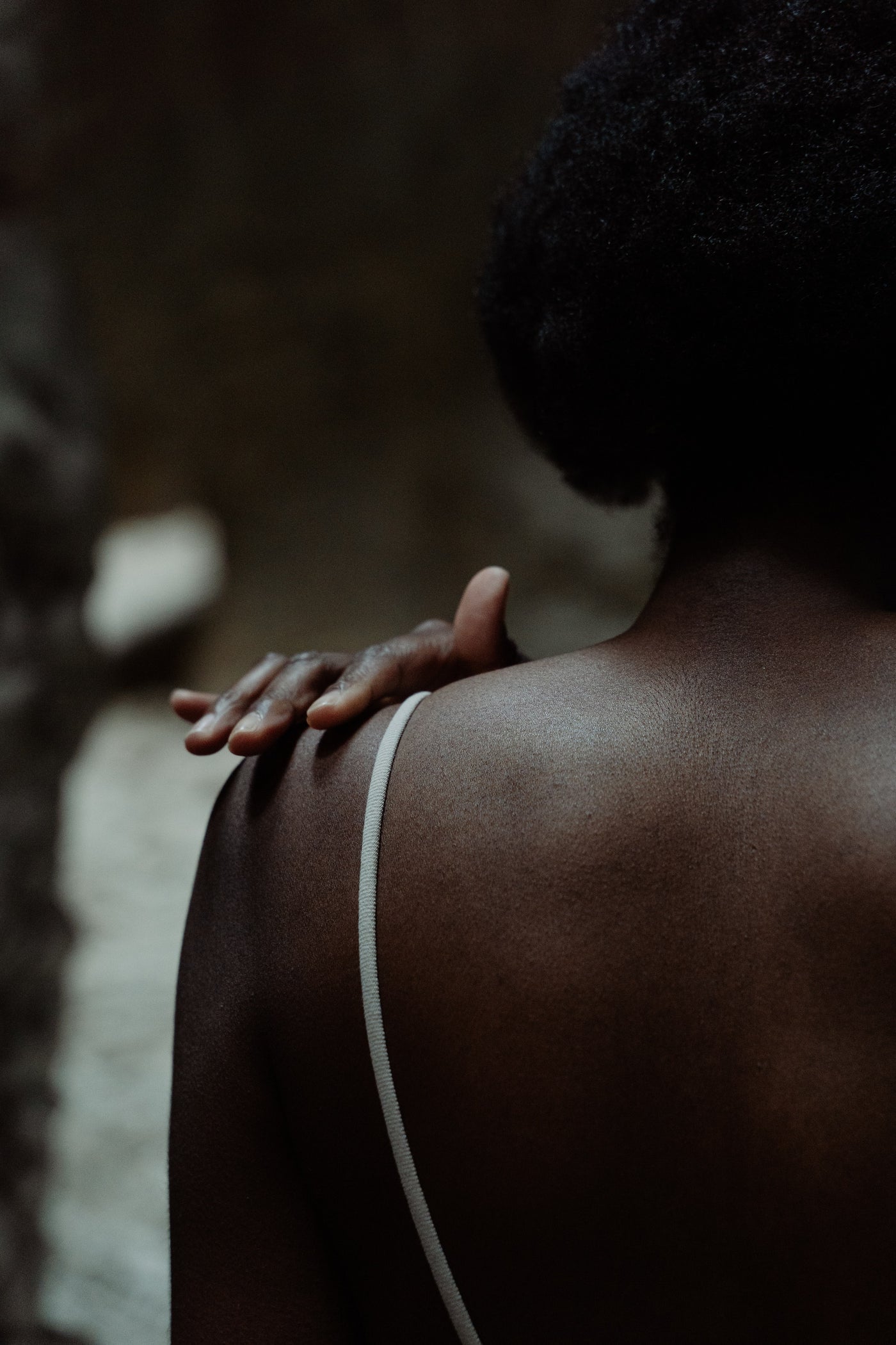 Dark skinned black woman's back